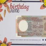 2 Rupees currency note matching your birthdate with birthday cover