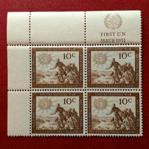 Stamp :- United Nations 1951 10¢ First Issue Stamp Block of Four – Featuring “Man Reaching for the Light” Design with Margin Inscription “FIRST U.N. ISSUE 1951”