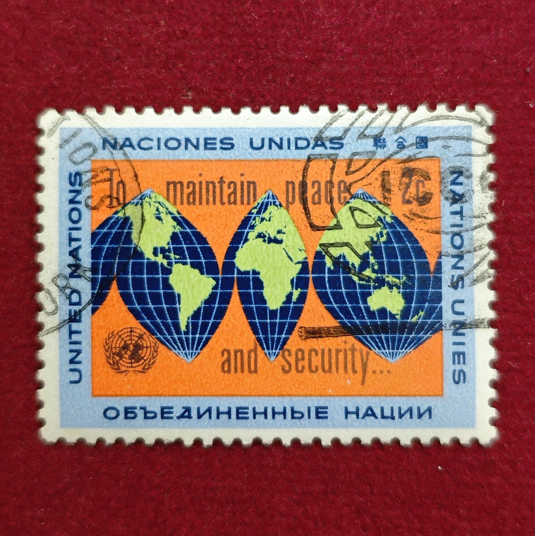 Stamp :- “United Nations 2¢ ‘To Maintain Peace and Security’ World Map Commemorative Stamp