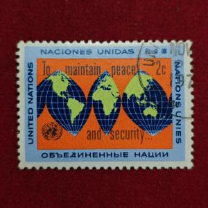 Stamp :- “United Nations 2¢ ‘To Maintain Peace and Security’ World Map Commemorative Stamp